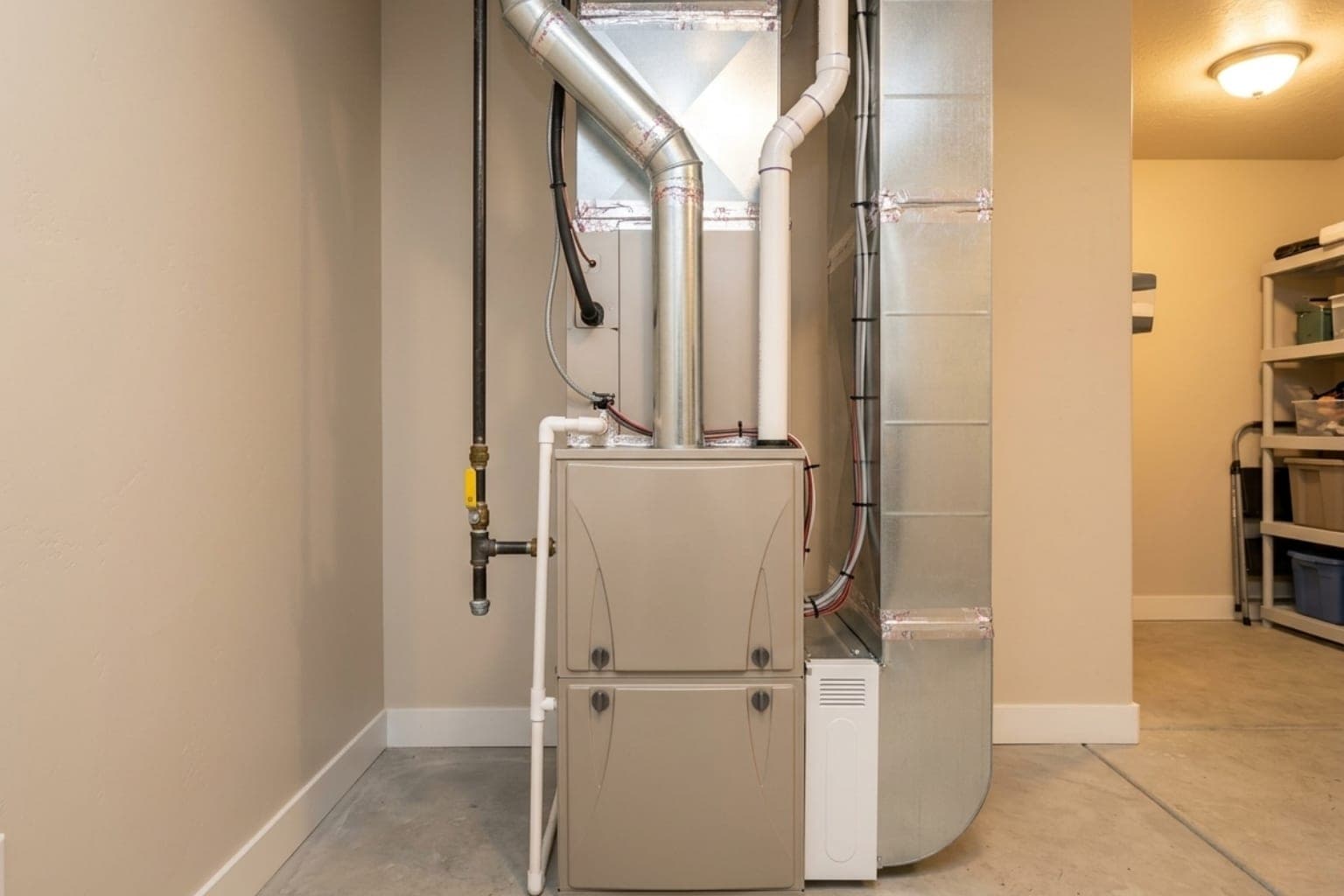 High-efficiency residential furnace professionally installed in a Utah utility room alongside new ductwork